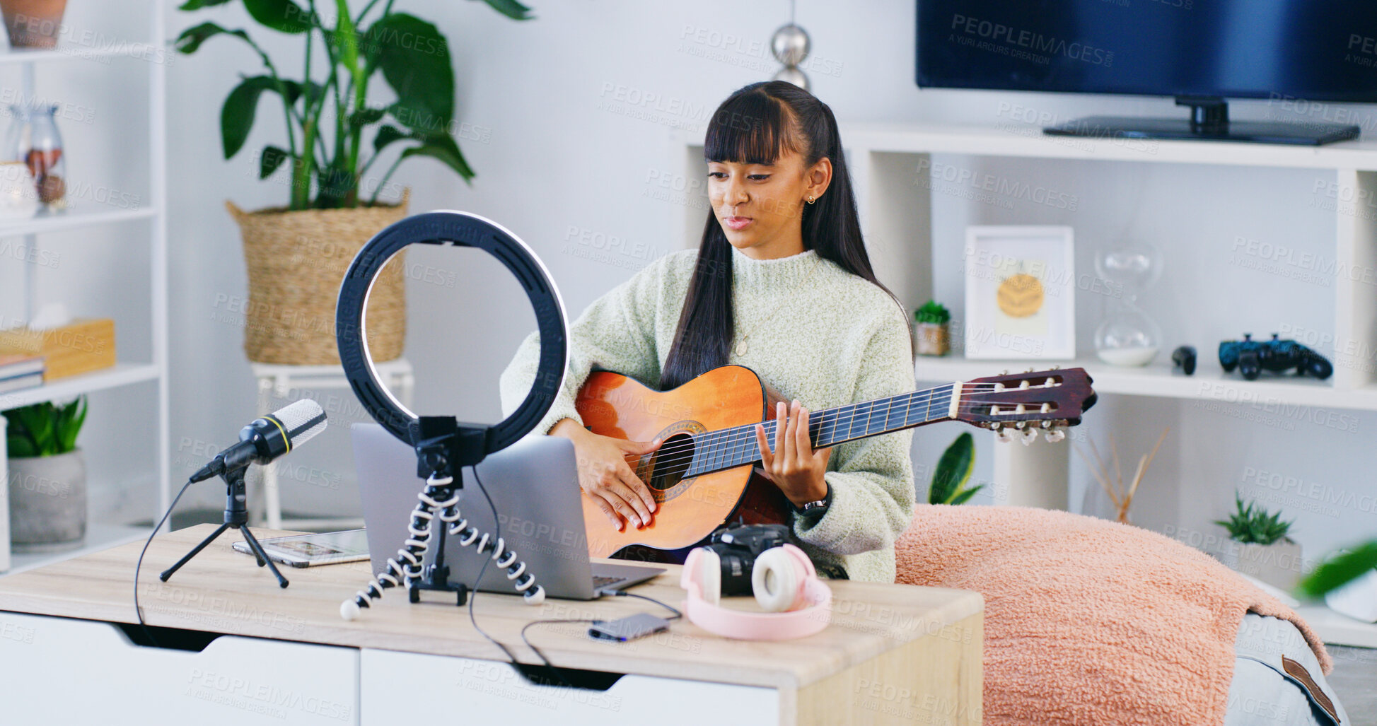 Buy stock photo Girl, guitar teacher and influencer with laptop, home and recording video for content creation on web. Teenager, computer and ring light with instrument, podcast and music tutorial on social network