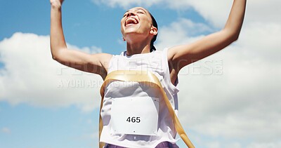 Buy stock photo Woman, marathon and celebration with ribbon at finish line with low angle, goals and winning performance. Person, champion and happy runner with achievement, success and shout for sports milestone