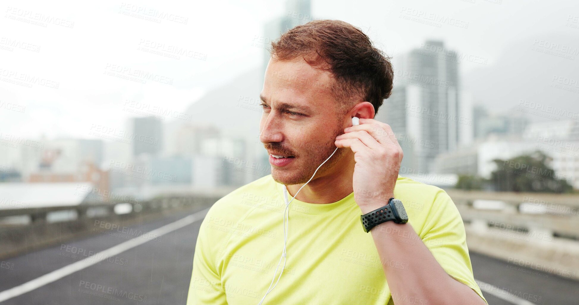 Buy stock photo Earphones, runner and man in city for exercise, marathon training and workout outdoor. Sports, athlete and person listening to music, audio and radio for wellness, health and fitness in urban town