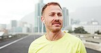 Thinking, earphones and man in city, fitness and calm with sound, exercise and audio tech. Playlist album, healthy person and runner with training, podcast and listening to music and streaming radio