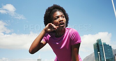 Buy stock photo Tired, fitness and black woman in city for rest, recovery or break for exercise, workout or training. Sports, below and person with fatigue, sweat and health in town for marathon, wellness or running