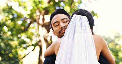 Buy stock photo Wedding, couple and smile with hug in nature for marriage celebration, love commitment and loyalty. Happy people, bride and groom with embrace at ceremony for relationship union, connection and bokeh