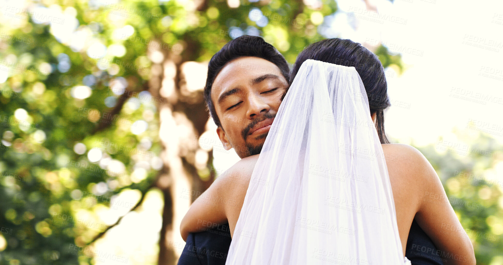 Buy stock photo Wedding, couple and smile with hug in nature for marriage celebration, love commitment and loyalty. Happy people, bride and groom with embrace at ceremony for relationship union, connection and bokeh