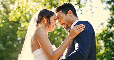 Buy stock photo Wedding, couple and love in park with smile, support and celebration for bridal union or marriage. Happy bride, groom and people in garden low angle for life partner, commitment or together outdoor