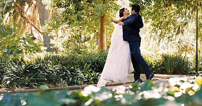 Buy stock photo Couple, wedding and dance outdoor, celebration and holding hands with smile, love and milestone. People, marriage and connection with commitment, relationship or happy at park with rhythm for event