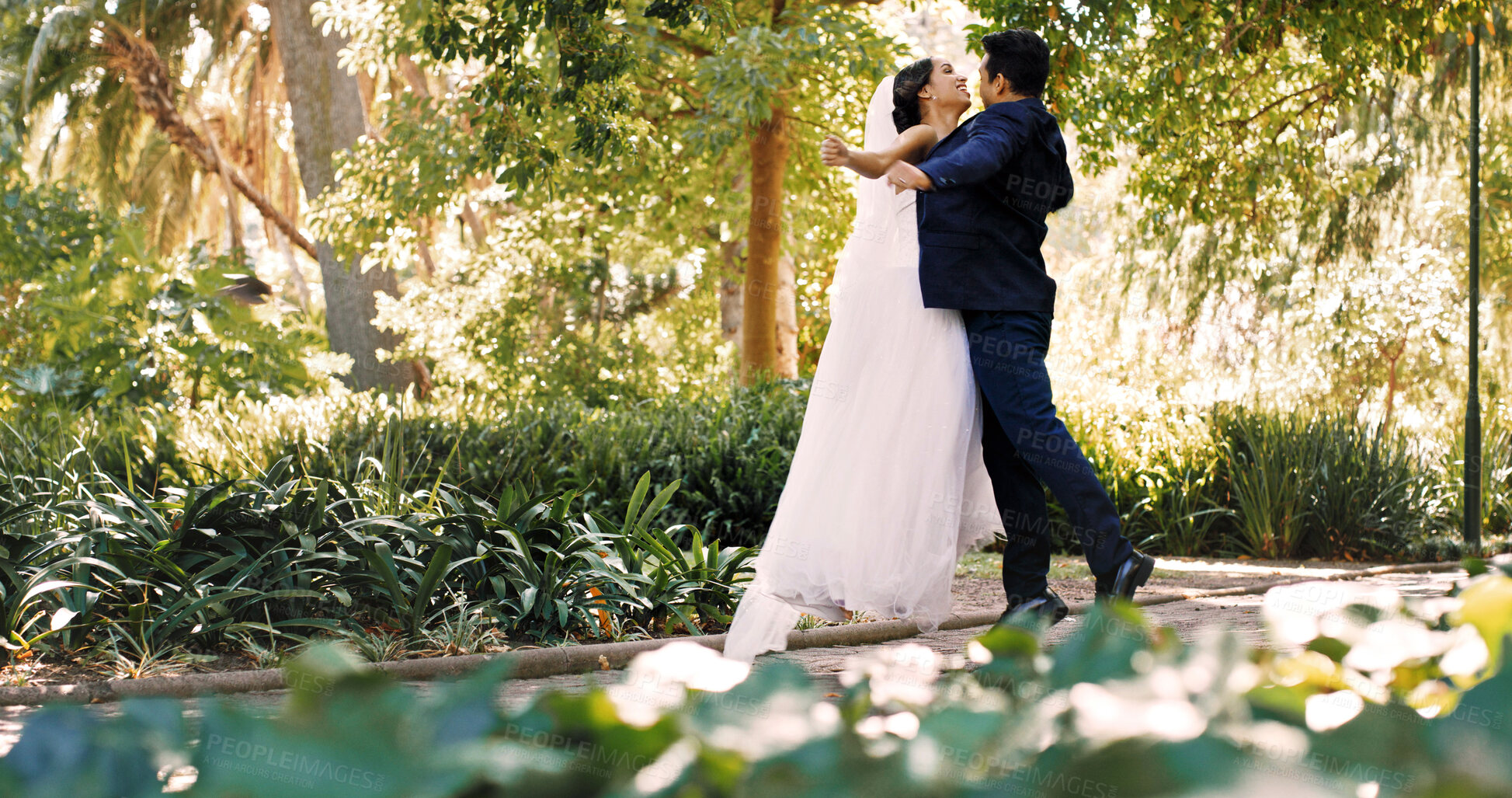 Buy stock photo Couple, wedding and dance outdoor, celebration and holding hands with smile, love and milestone. People, marriage and connection with commitment, relationship or happy at park with rhythm for event