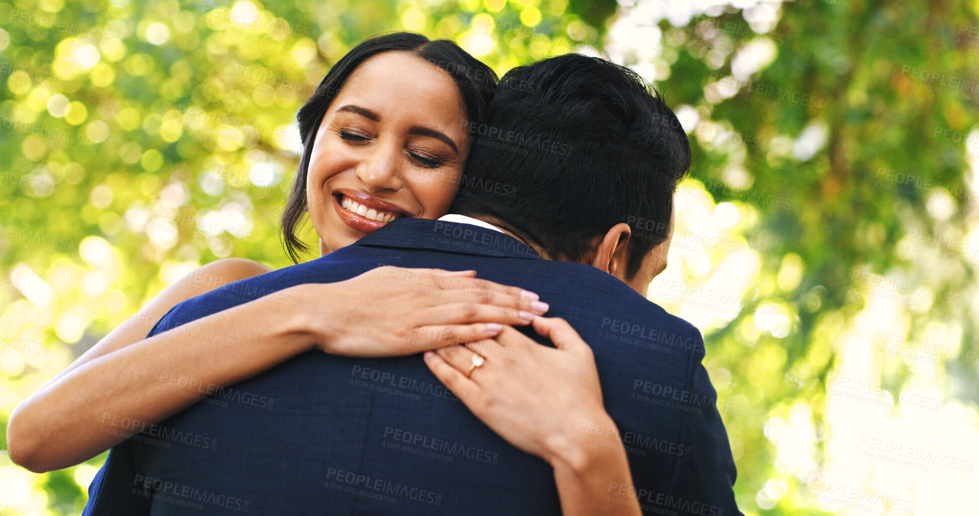 Buy stock photo Woman, hug man and outdoor at wedding, smile or connection for memory, milestone and relationship. People, embrace and excited bride with partner, commitment or marriage celebration at park in summer