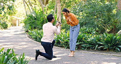 Buy stock photo Couple, surprise and proposal with ring at park for marry me gesture, engagement and save the date. Unexpected, people or partner with marriage promise, emotional reaction and relationship commitment