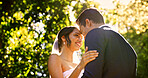 Wedding, couple and smile in park with nature, support and celebration for bridal union or marriage. Happy bride, groom and people in garden low angle for life partner, commitment or together outdoor
