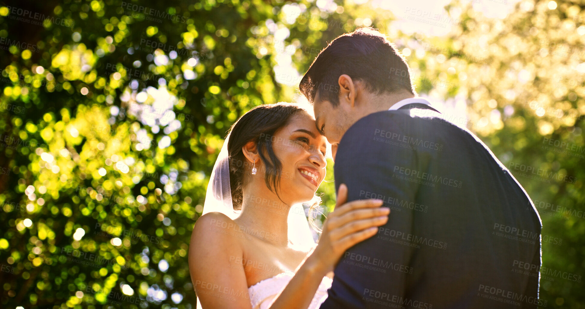 Buy stock photo Wedding, couple and smile in park with nature, support and celebration for bridal union or marriage. Happy bride, groom and people in garden low angle for life partner, commitment or together outdoor
