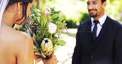 Buy stock photo Bride, smell bouquet and groom at park on wedding day, love or celebration for relationship milestone. People, couple and flowers with scent for marriage, event or outdoor with partner for commitment