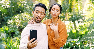 Buy stock photo Couple, phone and video call with talk at park, hello and virtual chat on mobile app in summer. People, partner and smartphone with discussion on social media, contact or smile in nature for bonding