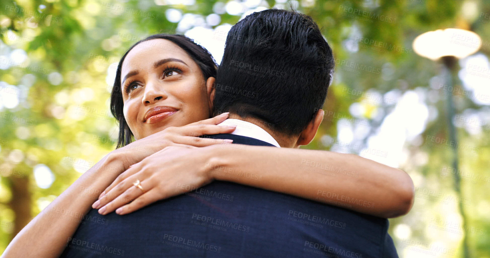 Buy stock photo Bride, hug man and outdoor at wedding, smile and thinking for memory, milestone and relationship. People, embrace and excited woman with partner, commitment or marriage celebration at park in summer