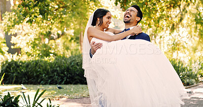 Buy stock photo Park, couple and laugh with carry at wedding for marriage celebration, funny reception and support. Happy people, groom and lifting bride at ceremony in nature for tradition, bonding together or joke