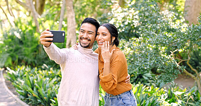 Buy stock photo Happy couple, proposal and selfie with ring for good news, engagement or commitment together. Man, woman or lovers with smile, app or mobile smartphone for photography, picture or memory of marriage