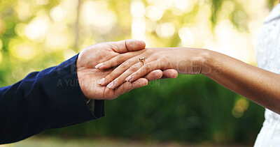 Buy stock photo Wedding, ring and couple in park holding hands for marriage, love and commitment for celebration. Affection, people and bride and groom together for bonding, relationship and romantic event outdoor