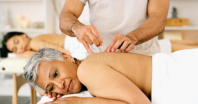 Buy stock photo Acupuncture, mature woman and relax in spa with needle for back pain, wellness or traditional medicine. Worker, senior person and rest at resort with pin for body care, ancient treatment and healing.