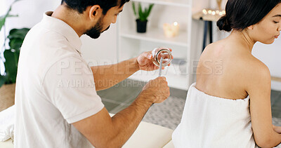 Buy stock photo People, lighter and cupping therapy for back pain, health and healing for muscle blood flow benefits. Therapist, holistic spa and woman with man for wellness, relax or resort with deep tissue massage