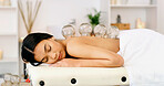 Woman, sleeping or massage with cupping therapy for healing or muscle tension in beauty spa. Calm, female person or relax with suction cups for stress relief, relaxation or Chinese medicine in salon