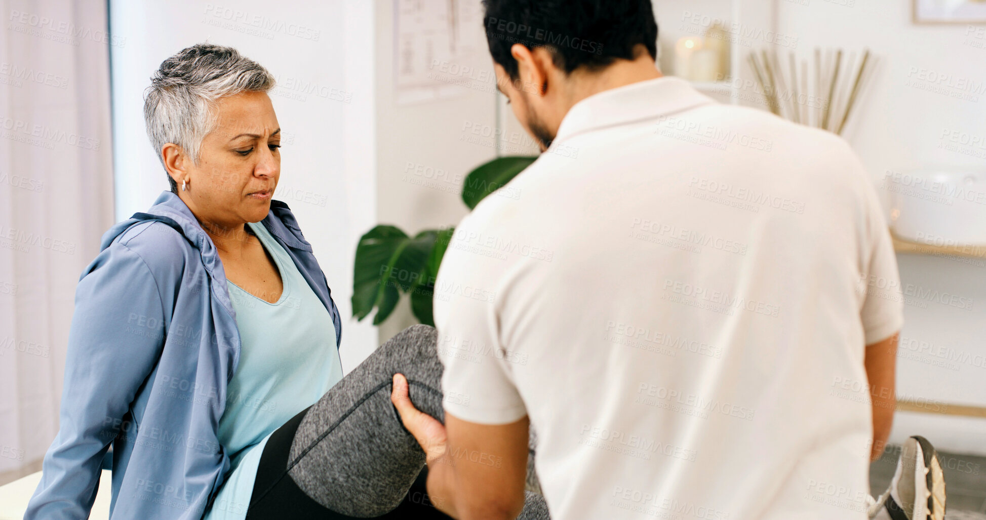 Buy stock photo Physiotherapy, leg stretch or woman in clinic for consultation, aid or service in rehabilitation. Healthcare, mature client or chiropractor in center with checkup, injury or visit for muscle recovery