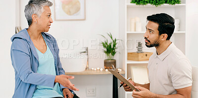 Buy stock photo Rehabilitation, physiotherapist and mature woman in clinic for recovery, wellness or health question. Consultation, chiropractor and person with injury, medical help or assessment with clipboard