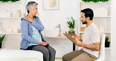 Buy stock photo Consultation, mature woman and physical therapist in office for health, wellness or shoulder injury. Rehabilitation, person and physiotherapist with chiropractor, medical help or diagnosis clipboard