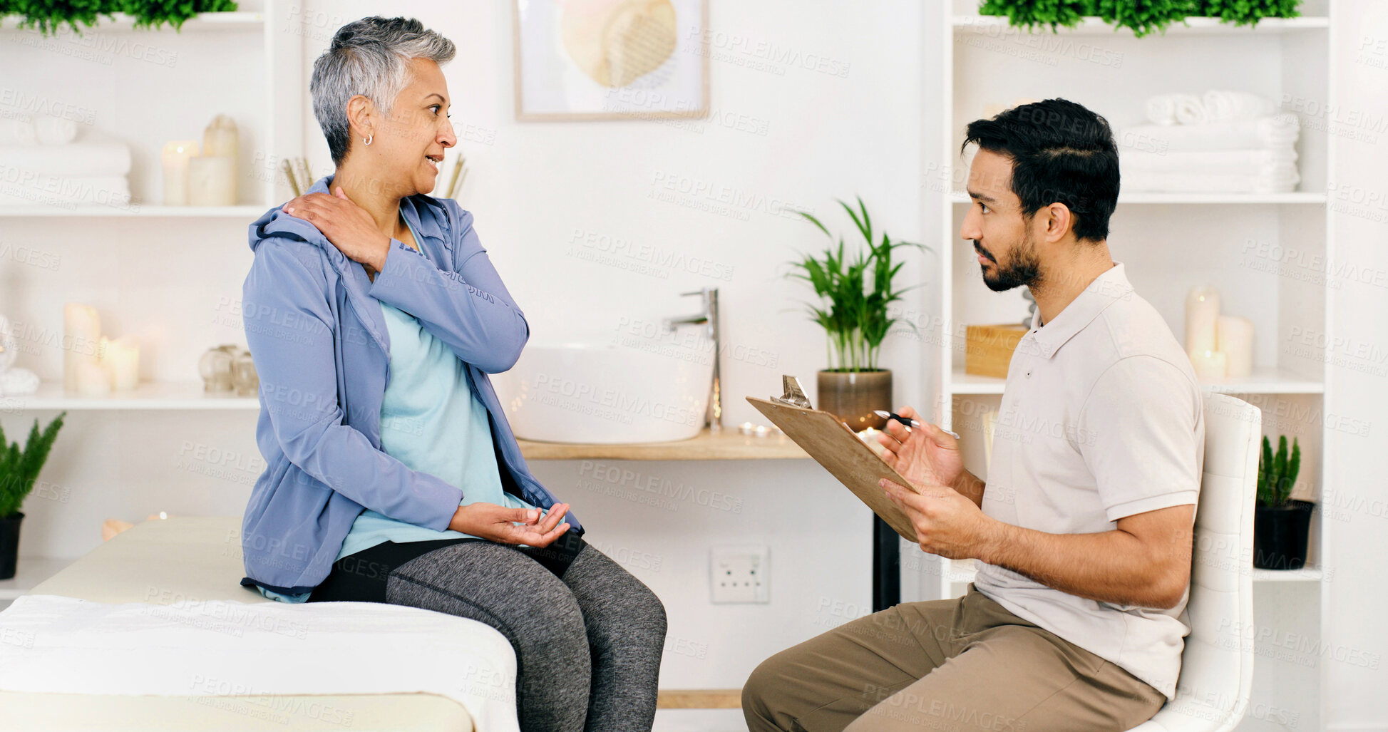 Buy stock photo Consultation, mature woman and physical therapist in office for health, wellness or shoulder injury. Rehabilitation, person and physiotherapist with chiropractor, medical help or diagnosis clipboard