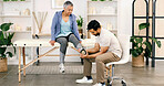 Foot pain, physiotherapy and man with old woman for consulting, wellness and rehabilitation. Healthcare, chiropractor and physical therapist with senior person for medical support, recovery and help