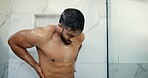Man, shower and wash back in bathroom, morning routine and water drops for dermatology at in home. Person, shirtless and cleaning for bacteria with grooming, healthy skin or wellness at apartment