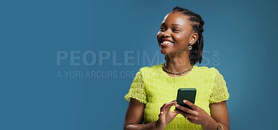 Buy stock photo Thinking, smartphone and black woman in studio, smile and communication on blue background. Mockup space, happiness or African person with cellphone, decision and email with wonder, app or thoughtful