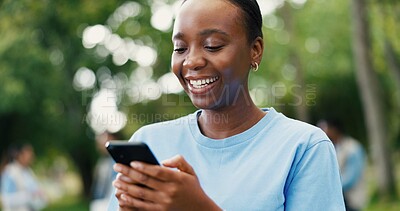 Buy stock photo Phone, smile and volunteer with woman in park for charity, community outreach or food drive. App, text message and typing with happy person outdoor for activism, donation or ngo communication