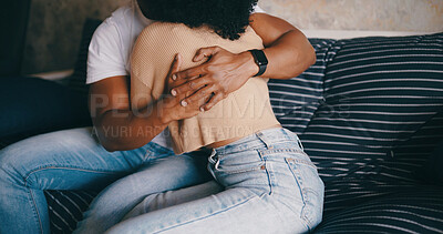 Buy stock photo Home, hug and couple on sofa, love and bonding together with care, trust and relationship. Apartment, man and woman on couch, empathy and compassion with embrace, hands and support in living room