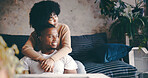 Thinking, couple and hug in lounge, chill and bonding on break with smile, trust and romance in home. Happy, man and embrace with woman in living room, affection and reflection for future or marriage