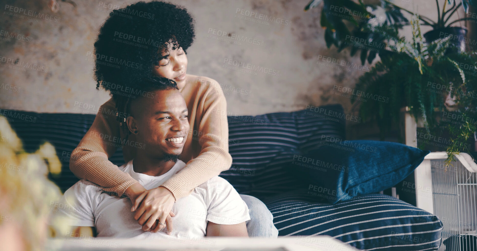 Buy stock photo Thinking, couple and hug in lounge, chill and bonding on break with smile, trust and romance in home. Happy, man and embrace with woman in living room, affection and reflection for future or marriage