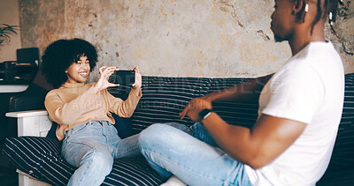 Buy stock photo Laugh, woman and picture of partner on sofa for funny memory, healthy relationship and support. Love, couple or happy with photography in home for status update, social media post or bonding together