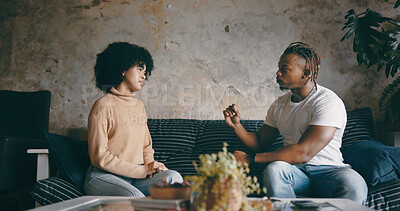 Buy stock photo Home, talking and black couple on sofa, disagreement and marriage with toxic relationship. Serious, man and woman on couch, conversation or listening with cheating, divorce or unhappy with breakup