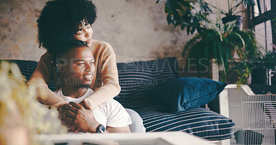 Buy stock photo Thinking, couple and hug in lounge, break and bonding on couch with smile, trust and romance in home. Happy, man and embrace with woman in living room, reflection and affection for partner in house