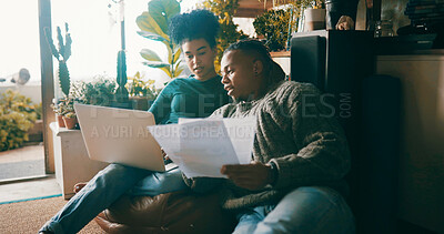 Buy stock photo African couple, finance documents and laptop in home, talk or budget review in living room. People, happy and discussion with computer, planning or feedback with asset management paperwork in house