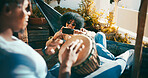 Outdoor, bongo or couple with phone on hammock, playing musical instrument or record video on balcony. Mobile app, live stream practice or happy people with hand drum in home, sunglasses or chilling
