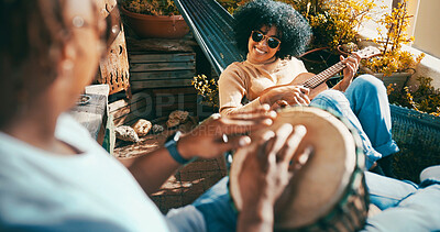 Buy stock photo Outdoor, bongo and couple with guitar on hammock, play musical instrument or bonding on balcony. Song practice, sunglasses or happy people with hobby in home, acoustic musician or chilling on weekend