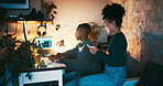 Night, couple and computer in home with phone for browsing internet, online search and bonding together. Evening, woman and man in apartment with desktop, mobile app or website for social media news.