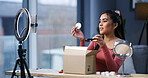 Girl, influencer and unboxing foundation with ring light, talk and review product on web show in home. Person, content creator and beauty for makeup, cosmetics or mobile app for social media at house