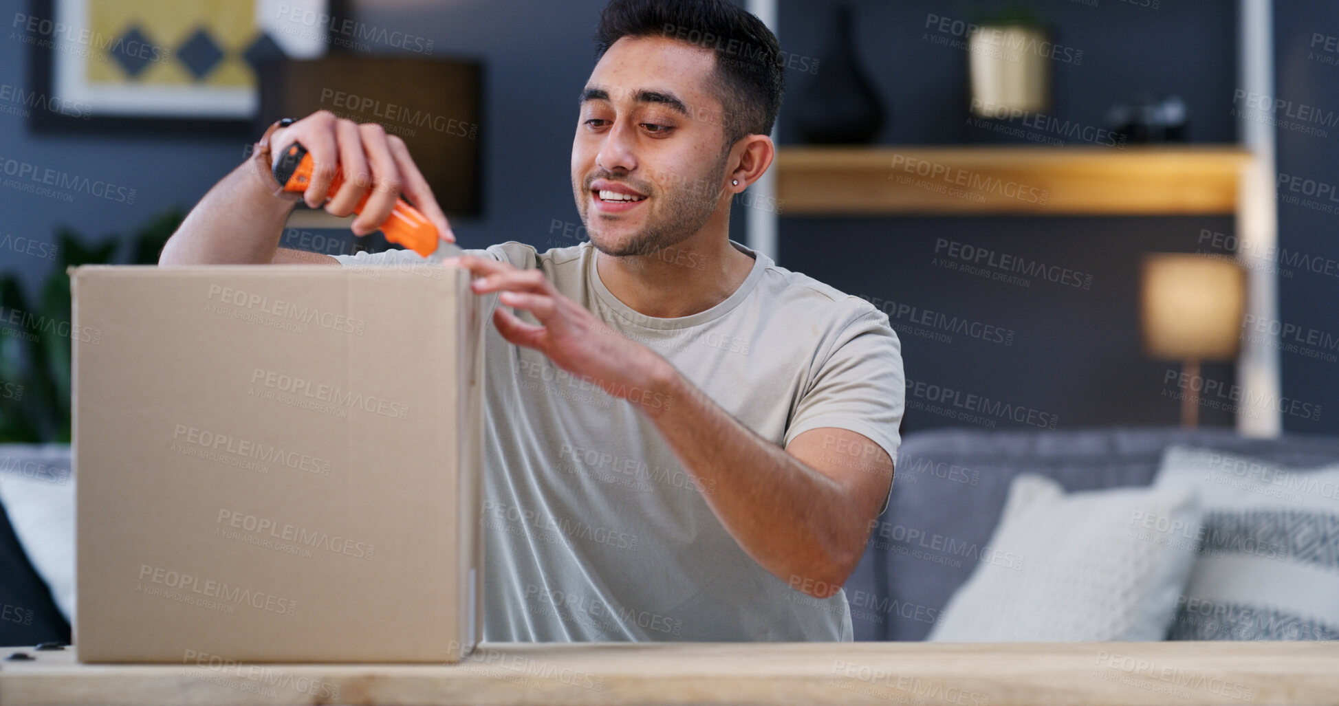 Buy stock photo Open, happy and man with box in home for ecommerce package, courier service and delivery. Apartment, unpacking and person with cutter for parcel for online shopping, order and shipping in living room