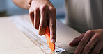 Opening, hands and man with box cutter in home for ecommerce package, courier service and delivery. Apartment, unpacking and person with parcel for online shopping, order and shipping in living room