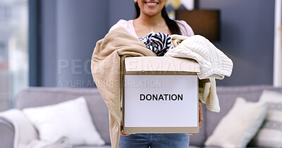 Buy stock photo Donation, charity and woman with clothing for nonprofit, spring cleaning and box in home. Living room, community support and person with smile for giving, volunteer and parcel for outreach giveaway