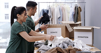 Buy stock photo Happy couple, packing and box with clothing donation for charity, welfare or giveaway in home. Man, woman or volunteer with smile, package or donate for community service or humanitarian aid in house