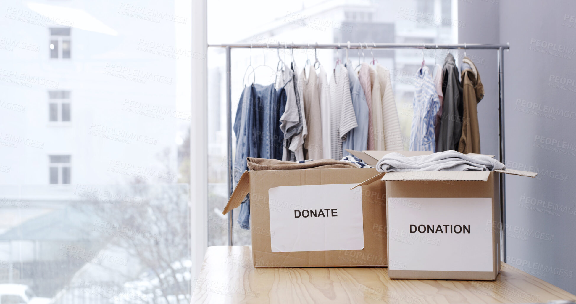 Buy stock photo Donation box, charity and empty with clothes for nonprofit and cardboard container. Sign, donating and community center with care, spring cleaning and support with NGO project and storage with offer