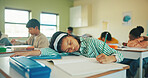 Tired, child and student sleeping in classroom for education, learning fatigue and boring lesson. Exhausted, kid and nap on desk for study burnout, school pressure and overworked with academic exams