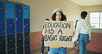 Portrait, school and girl with sign, protest and education with placard, activism and empowerment. Learning, student and child in hallway, basic rights and banner to promote equality and awareness