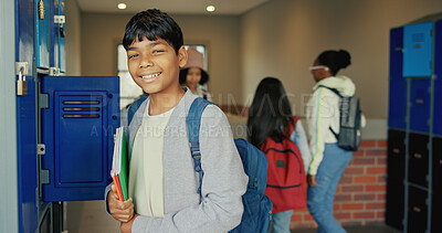 Buy stock photo Happy, education and portrait of boy at lockers for future, child development and knowledge. Studying, growth and academy with student in school campus for learning, course curriculum and books